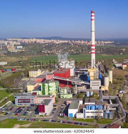 Aerial view of heating plant and thermal power station. Combined modern power station for city district heating and electrical power production. Industrial zone from above.
