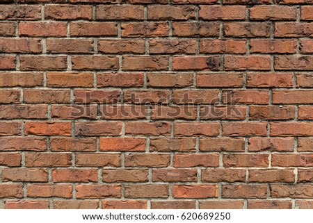 Brick Wall.  An aged and patched, multi-textured brick wall for backgrounds or presentations.