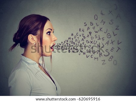 Woman talking with alphabet letters coming out of her mouth. Royalty-Free Stock Photo #620695916