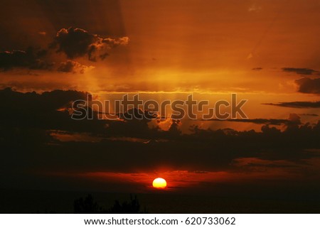 A beautiful sunset behind the clouds