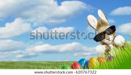 Easter banner with Easter eggs and Easter bunny Royalty-Free Stock Photo #620767322