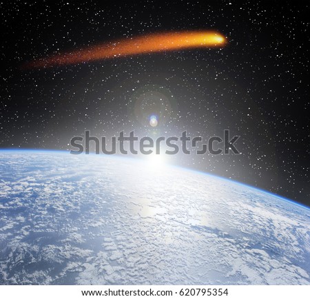 Comet flying above the earth globe. Comet impact. "The elements of this image furnished by NASA"
