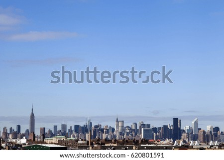 The Manhattan skyline as seen from Brooklyn on a sunny day.
