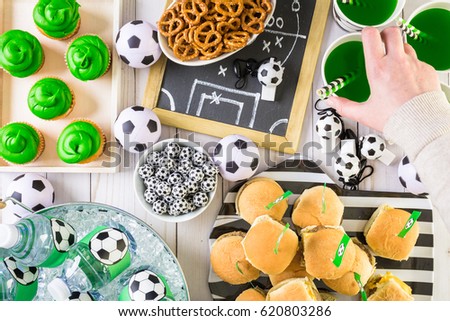 Table with snacks for football party.