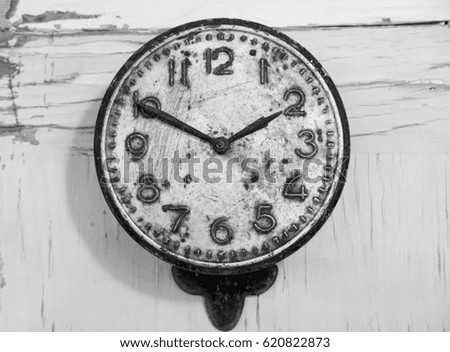 Vintage Black and white clock with dirts and scratches