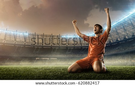 soccer player celebrating goal on a soccer field during the match Royalty-Free Stock Photo #620882417