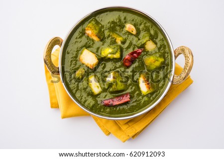 Palak Paneer Curry made up of spinach and cottage cheese, Popular Indian healthy Lunch/Dinner food menu, served in a Karahi with Roti Or Chapati over moody background. selective focus Royalty-Free Stock Photo #620912093