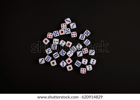 the dice concept for business risk, chance, good luck or gambling, black paper background