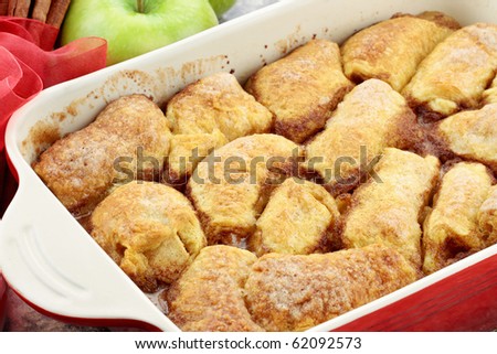 Apple dumplings. Apples wrapped in crescent roll dough and baked in butter, cinnamon, sugar and citrus soda pop. Shallow DOF.