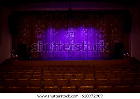 An empty stage of the theater, lit by spotlights and smoke before the performance, a curtain theater