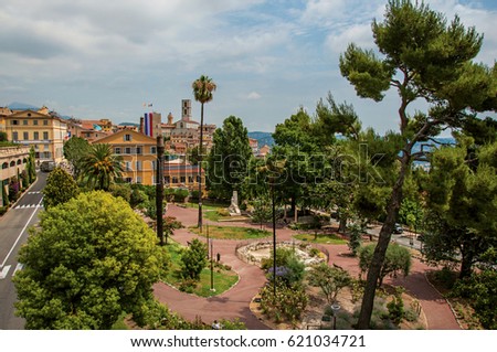 Landscaped square with buildings and street in the city center of Grasse, a friendly town known for producing perfumes. Located in the Alpes-Maritimes department, Provence region, southeastern France