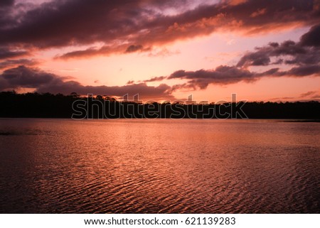 A picturesque view of Lake Kurwongbah as the sun is setting. This photo was taken in Brisbane, Australia. 