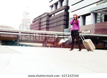 Woman is traveling alone. She has just arrived at the station.