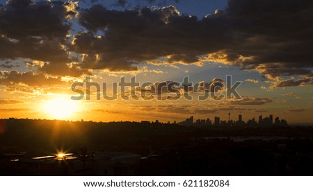 Sydney cityscape silhouette during sunset.