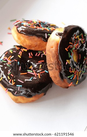 Lush donuts with chocolate icing and bright sprinkles