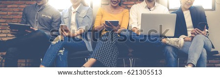 Group Adult Business Friends Sitting Chair Using Modern Gadgets.Business Startup Friendship Teamwork Concept.Creative People Working Together Sale Project.Coworking Wide and brainstorm Royalty-Free Stock Photo #621305513