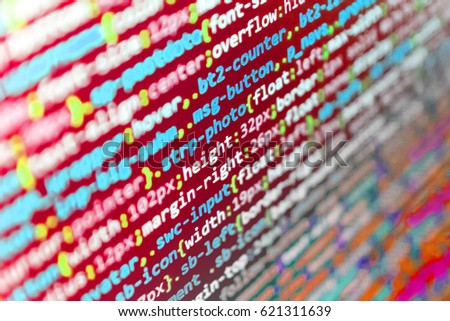  
Abstract IT technology background.  Webdesigner Workstation. Notebook closeup photo.  Binary digits code editing. Writing programming code on laptop. Coworkers team in modern office. 
