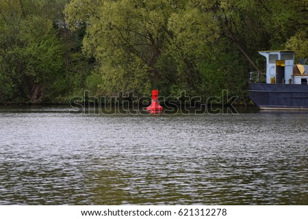 River buoy, floating beacon, floater, flow mark on a river, Germany