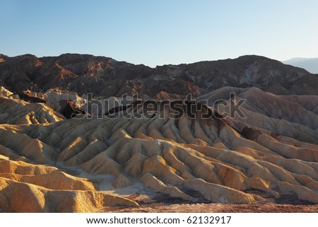 Pink sunset in Death Valley. Soft sand waves of the famous Zabriskie - Point