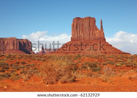 The majestic Monument Valley. Famous bright orange sandstone rock "Mittens"