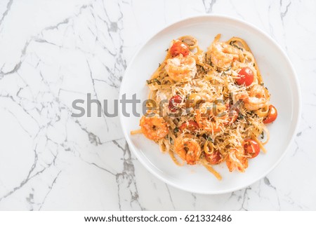 delicious spaghetti with shrimps, tomatoes, basil and cheese - italian food style