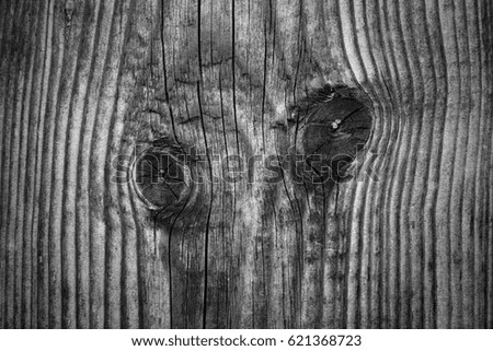 Old plank wooden wall background. The texture of old wood. Weathered piece of wood. Image includes a effect the black and white tones.