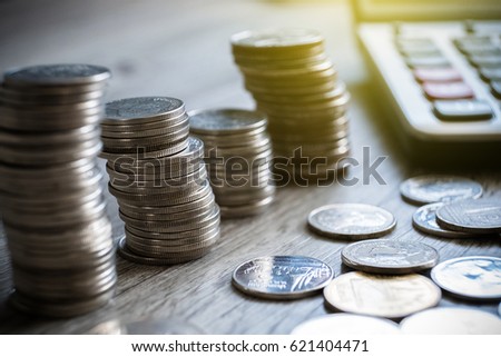 thai coins put together in rows and spread on wooden table, business concept

