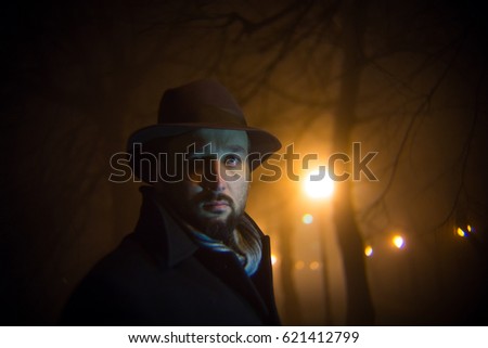 Man at night walking on the street