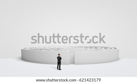 A tiny businessman standing in front of a large white round maze right next to the entrance. Business problems. Unknown future. Entering into new venture.
