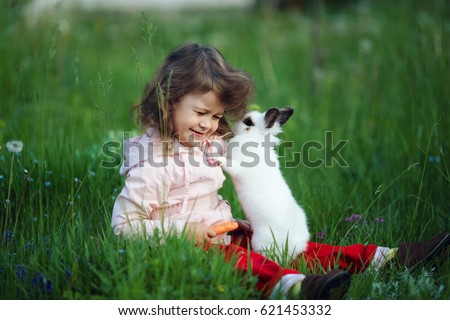 cute little girl with white rabbit