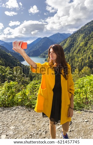 Young beautiful long hair woman making emotional selfi