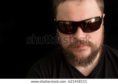 Handsome bearded man in sunglasses