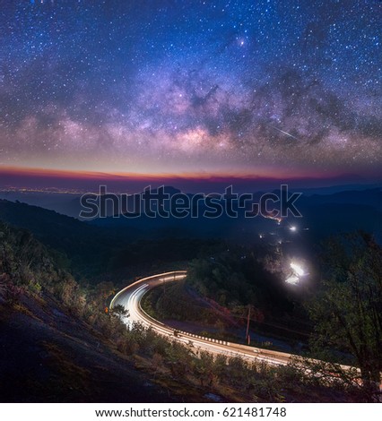 Milky Way Galaxy with street and light trails on Doi inthanon Chiang mai, Thailand.