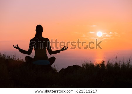 Yoga meditation at sunset. 