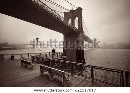 Brooklyn Bridge in a foggy day in downtown Manhattan