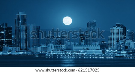 San Diego downtown skyline and full moon over water at night in BW