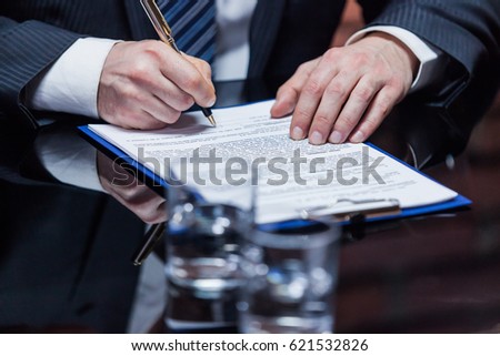 Businessman placing the signature