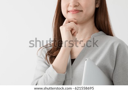 Woman holding a laptop computer, business, think