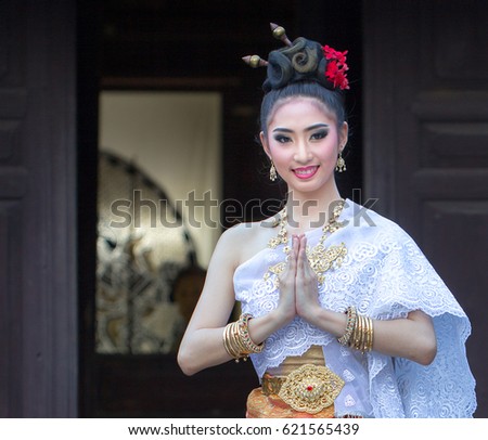 Thai woman wearing typical Thai dress, identity culture of Thailand /  costume Thai beautiful women costume design ,fashion costume thai style thailand / soft focus picture 