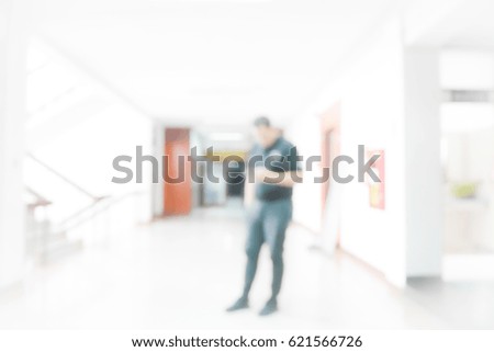 Picture blurred abstract background of people in building office