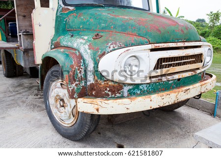 Vintage rusty green truck car in garage
