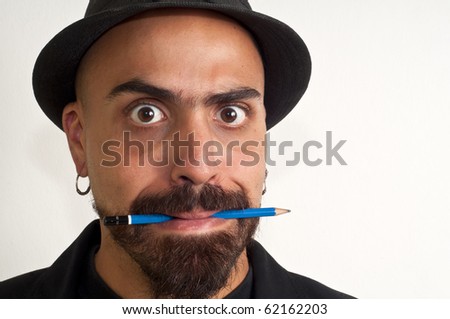 man with a pencil and a hat with funny expression with white background