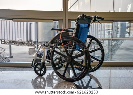 wheel chair at the airport Royalty-Free Stock Photo #621628250