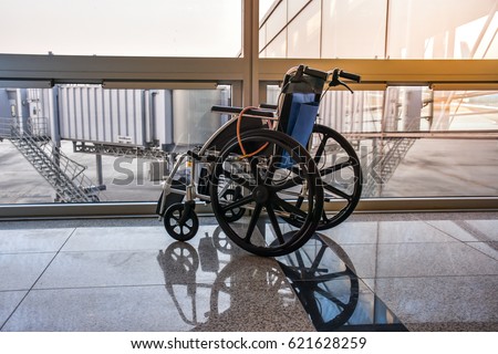 wheel chair at the airport Royalty-Free Stock Photo #621628259