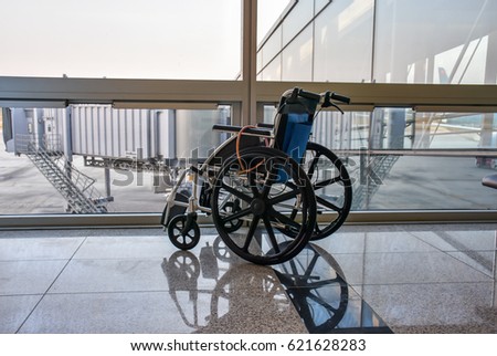 wheel chair at the airport Royalty-Free Stock Photo #621628283