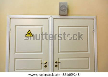 The triangular yellow sign of the danger of electric shock