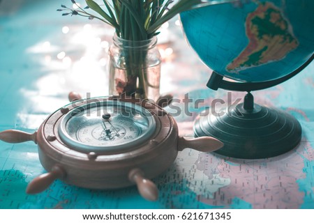 Globe and barometer on the map against the background of garlands Royalty-Free Stock Photo #621671345