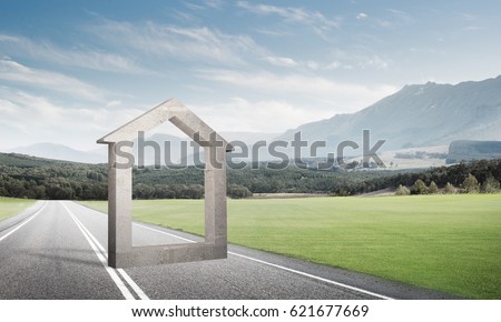 House stone figure as symbol of real estate outdoors against natural landscape