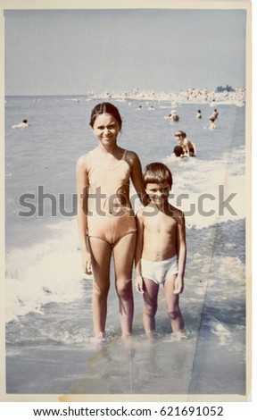 USSR, ABKHAZIA, LESELIDZE - CIRCA 1980: Vintage photo of family vacation on Black sea beach in Abkhazia, USSR