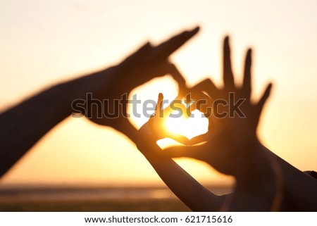 Hands making hearts